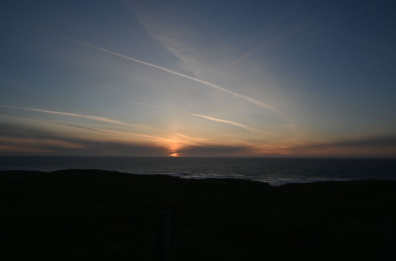 Sunset over a distant coastline
